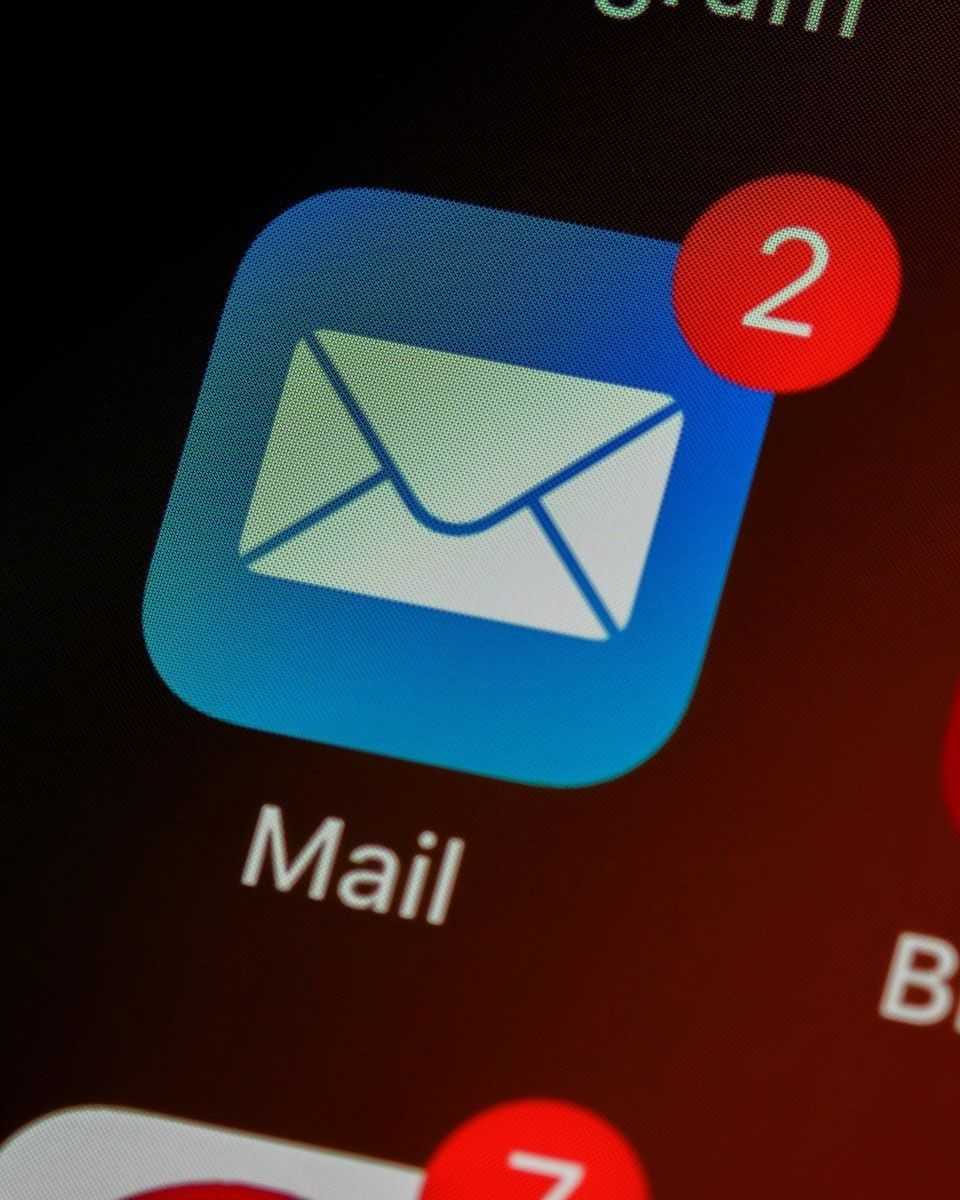 Close-up of a mail app icon on a phone screen
