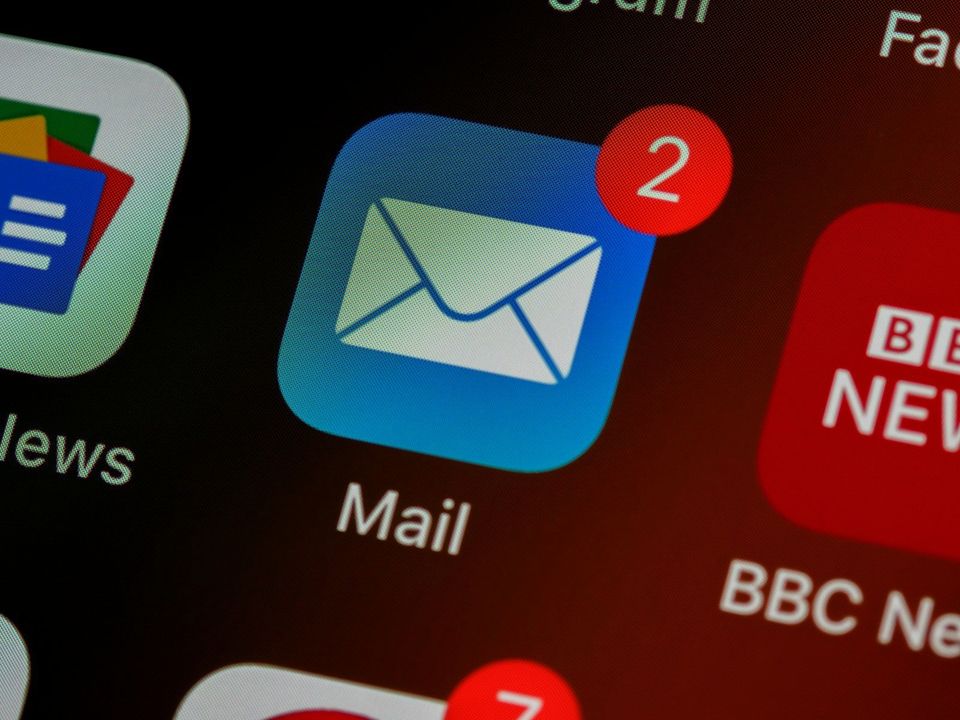 Close-up of a mail app icon on a phone screen