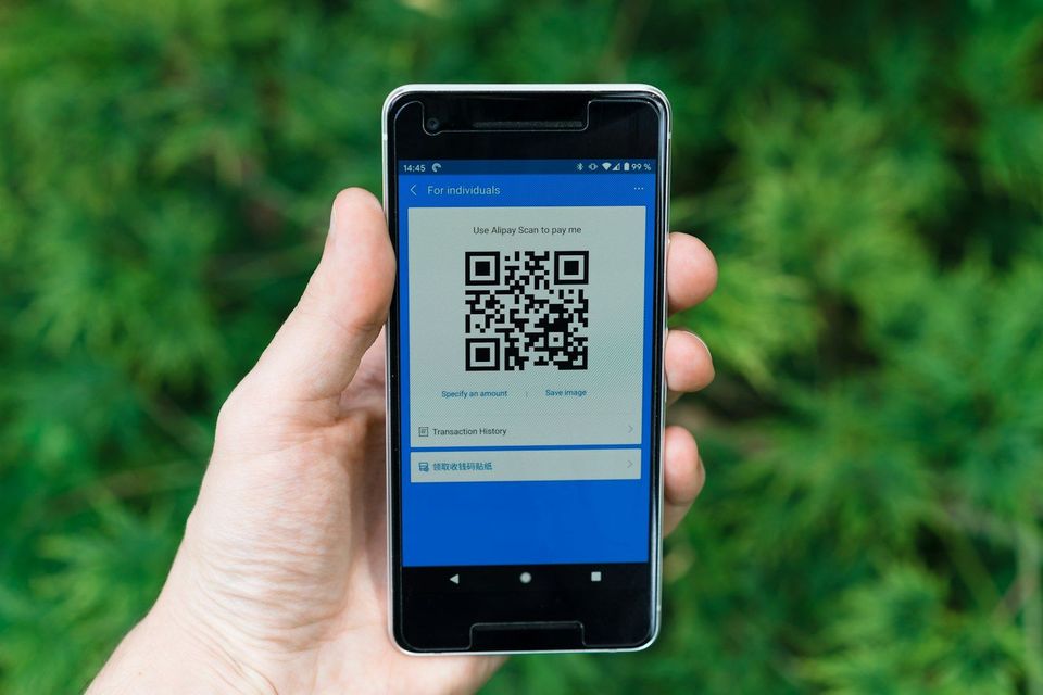 A smartphone displaying a QR code for scanning