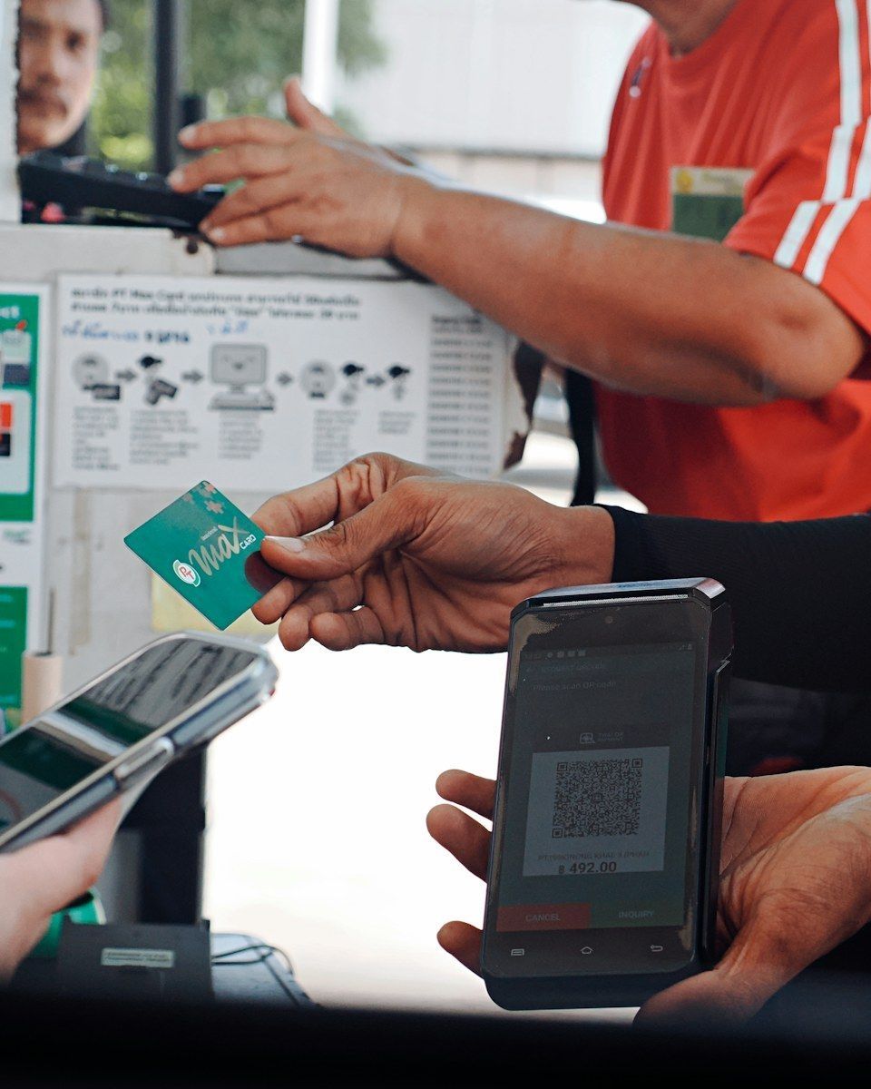 Customer making a mobile payment at checkout