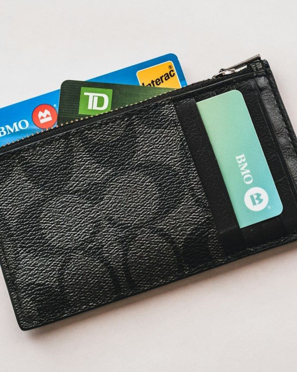 Wallet with several credit cards sticking out