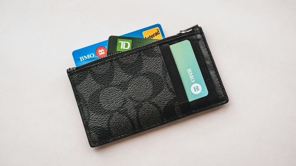 Wallet with several credit cards sticking out